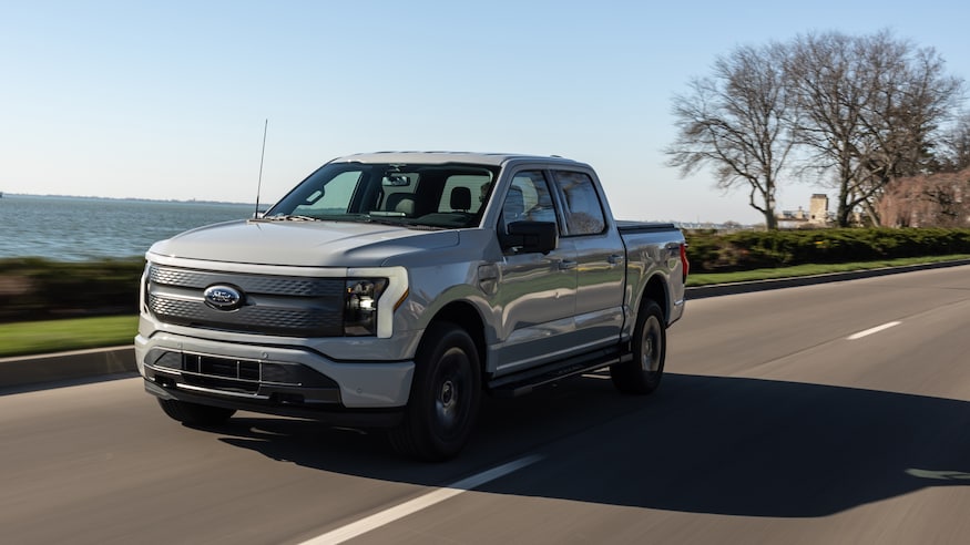 2023 Ford F 150 Lightning XLT LT3 front three quarters in motion 1