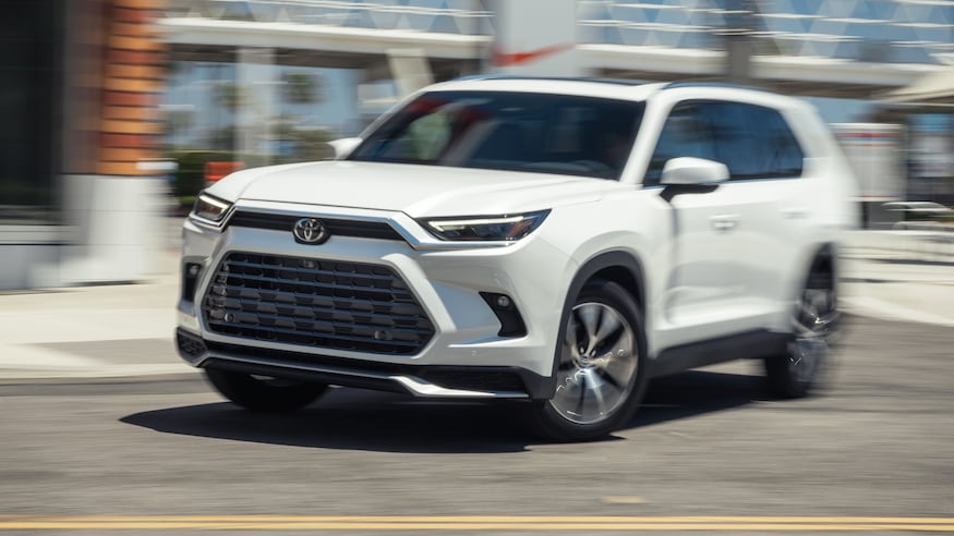 002 2024 Toyota Highlander Limited front three quarters in motion
